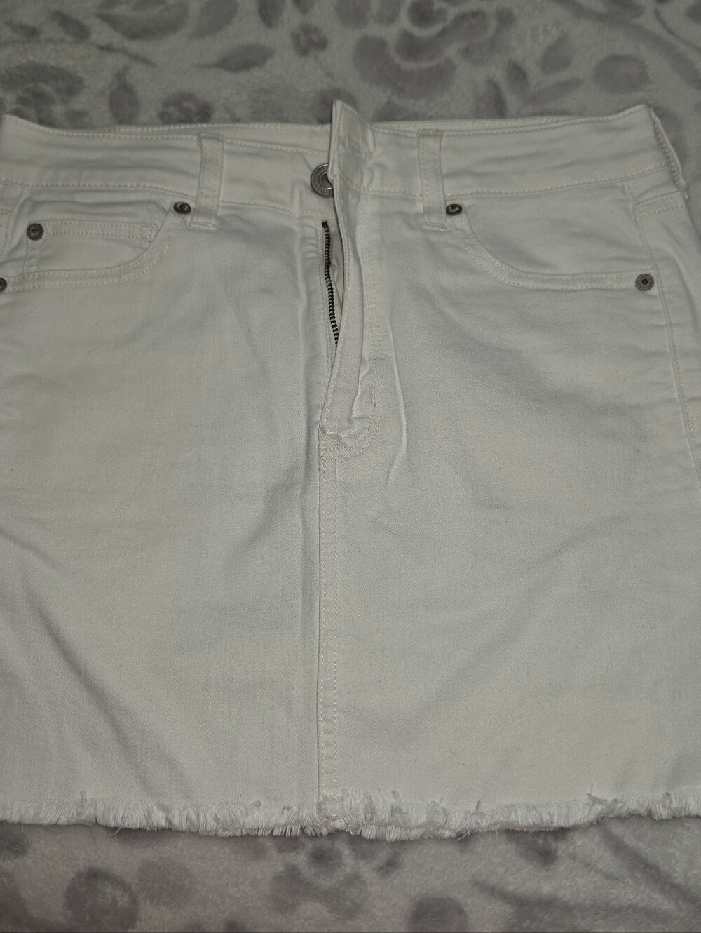 American Eagle White Denim Mini Skirt with Frayed Hem